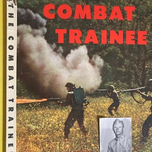 May include: A vintage book cover with the title "The Combat Trainee" in red letters. The cover features a black and white photo of a soldier in uniform, a photo of soldiers in combat, and the text "Camp Pendleton, California, Company "1"".
