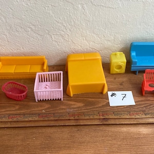 Small dollhouse furniture and miniatures includes 1940s and 1950s kitchen, bathroom, and bedroom pieces ideal for 2-inch and 3-inch dolls