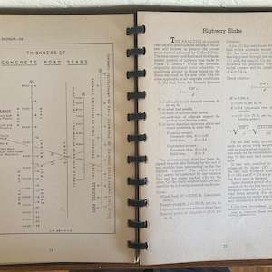 May include: An open book displays technical diagrams and text related to concrete road slabs. The left page features a graph illustrating slab thickness, while the right page provides analysis and formulas. The book is open to pages 74 and 75.
