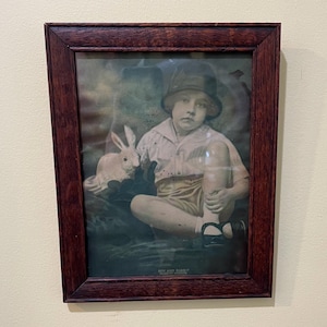 May include: A white ceramic mug with a black handle and the text "But First, Coffee" in a handwritten style. The mug is on a white surface. The mug is likely for hot beverages.