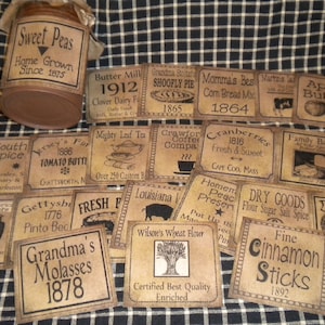 May include: A collection of vintage-style labels with various product names and dates. The labels are printed on brown paper with black ink and feature illustrations of various items, such as a jar of butter, a loaf of bread, a teacup, and a pig. The labels are arranged in a grid pattern on a black and white checkered surface.