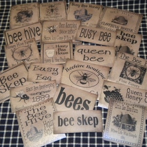 May include: A collection of vintage-style labels with bee-themed designs. The labels feature text such as "Bee Hive", "Queen Bee", "Busy Bee", and "Bee Skep". The labels are printed on a brown paper background with black ink.