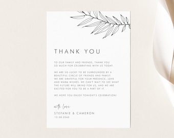 May include: A white thank you card with black text and a minimalist botanical illustration. The card reads "THANK YOU" and includes a message of gratitude, names, and a date. The card is from Belle Hanah Paperie.