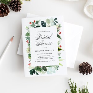 Peut inclure: Une carte blanche avec une bordure florale aquarelle verte et rouge. Le texte indique "Vous &ecirc;tes invit&eacute; &agrave; un Shower de Mariage en l'honneur d'Eleanor Phillips, le 16 d&eacute;cembre &agrave; 14h30, The Bishop Home, 241 Maine Ave, Toronto, ON, Organis&eacute; par Sophie & Jake, Veuillez SVP confirmer votre pr&eacute;sence au 888 987 6543 avant le 5 d&eacute;cembre."