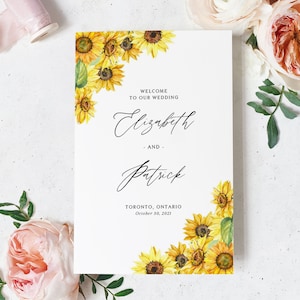 Può includere: Un invito di nozze con un bordo di girasoli. Il testo recita "Benvenuti al nostro matrimonio, Elizabeth e Patrick, Toronto, Ontario, 30 ottobre 2021".