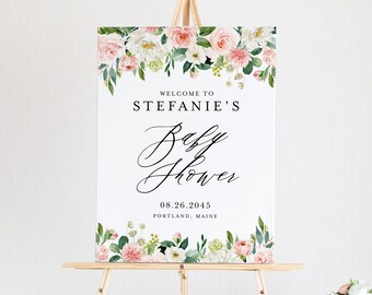 May include: Welcome to Stefanie's Baby Shower sign with pink and white floral border. The sign is on a wooden easel. The text reads: Welcome to Stefanie's Baby Shower 08.26.2045 Portland, Maine.