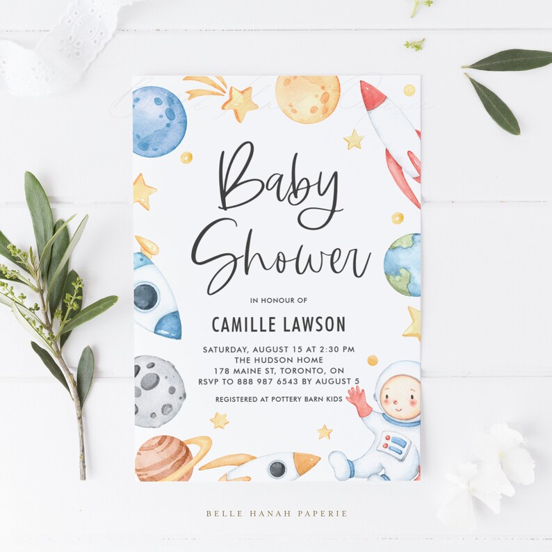 May include: A baby shower invitation with a space theme. The invitation features a watercolor illustration of a rocket, planets, stars, and an astronaut. The text on the invitation reads "Baby Shower" in honor of Camille Lawson. The date, time, and location of the shower are also included.