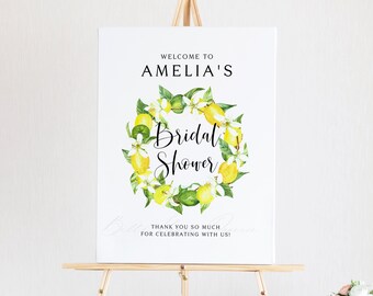 Peut inclure: Une pancarte blanche avec une couronne de citrons et le texte "Bienvenue au shower nuptial d'Amelia. Merci beaucoup d'être là pour fêter avec nous !"