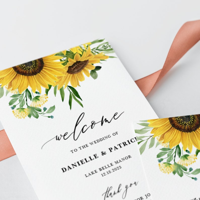 May include: A welcome sign for a wedding with a sunflower floral design. The text reads "Welcome to the wedding of Danielle & Patrick" and "Lake Belle Manor 12.18.2023".