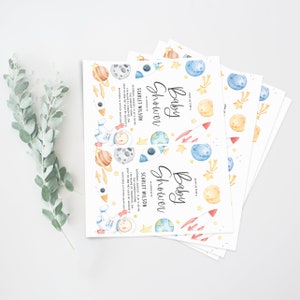 May include: A set of baby shower invitations with a space theme. The invitations feature a watercolor illustration of an astronaut, planets, stars, and rockets. The text on the invitations reads "Baby Shower" and includes the date, time, and location of the event.