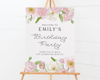 May include: Welcome to Emily's Birthday Party sign with pink and white floral border. The sign is on a wooden easel.