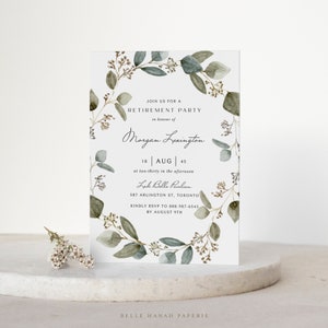 May include: A white invitation card with a green watercolor wreath border. The text reads "Join us for a Retirement Party in honor of Morgan Lexington 18 AUG | 45 at two-thirty in the afternoon Lake Belle Pavilion 587 Arlington St, Toronto Kindly RSVP to 888-987-6543 by August 9th Belle Hanah Paperie".