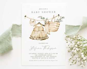 May include: A watercolor illustration of a baby shower invitation with a dress, a bag, and a bib hanging on a clothesline. The text reads "Join us for a Baby Shower Celebrating Stefanie Thompson Saturday, August 18th at 2:30 PM The Anderson Home 1405 Rosemary St, Los Angeles Hosted by Olivia & Sawyer Kindly RSVP to 888 987 6543 by August 3rd Belle Hanah Paperie"