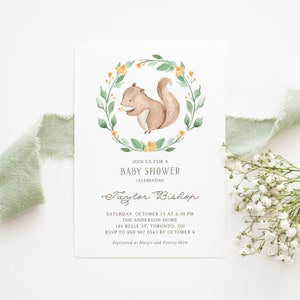 May include: A baby shower invitation featuring a watercolour illustration of a squirrel holding a flower within a wreath of green leaves and yellow flowers. The text reads "Join us for a Baby Shower Celebrating Taylor Bishop Saturday, October 13 at 2:30 PM The Anderson Home 184 Belle St, Toronto, ON RSVP to 888 987 6543 by October 8 Registered at Macy's and Pottery Barn"