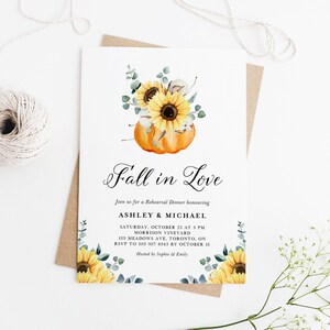 May include: Fall in Love rehearsal dinner invitation featuring a watercolour illustration of a pumpkin with sunflowers and eucalyptus leaves. The invitation includes the date, time, location, and RSVP details. Hosted by Sophie & Emily.