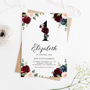 May include: A burgundy and blue floral first birthday invitation with a large black number one and the name Elizabeth. The invitation includes the date, time, and location of the party, as well as an RSVP number and deadline.