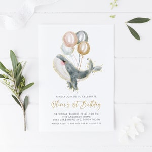 May include: A watercolor illustration of a whale with gold glitter holding balloons in shades of pink, blue, and gold. The text reads "Kindly join us to celebrate Oliver's 1st Birthday. Saturday, August 28 at 2:00 PM. The Anderson Home. 1092 Lakeshore Ave, Toronto, ON. Kindly RSVP to 888 9876 543 by August 20."