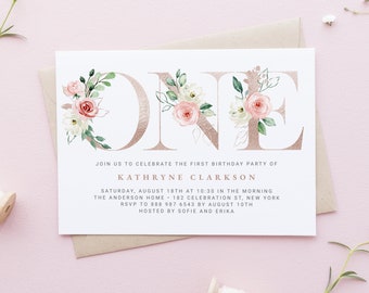 May include: A white invitation with gold foil lettering for a first birthday party. The invitation features the number "ONE" decorated with pink and white flowers. The text reads "Join us to celebrate the first birthday party of Kathryne Clarkson. Saturday, August 18th at 10:30 in the morning. The Anderson Home - 182 Celebration St, New York. RSVP to 888 987 6543 by August 10th. Hosted by Sofie and Erika."