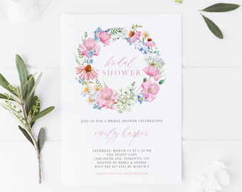 Pode incluir: Uma coroa de flores com flores rosa e azuis envolve o texto "bridal shower" em escrita rosa. O convite é para o chá de panela de Emily Harper no dia 15 de março às 14h30 no The Peony Cafe em Toronto, Ontário. RSVP até 5 de março.