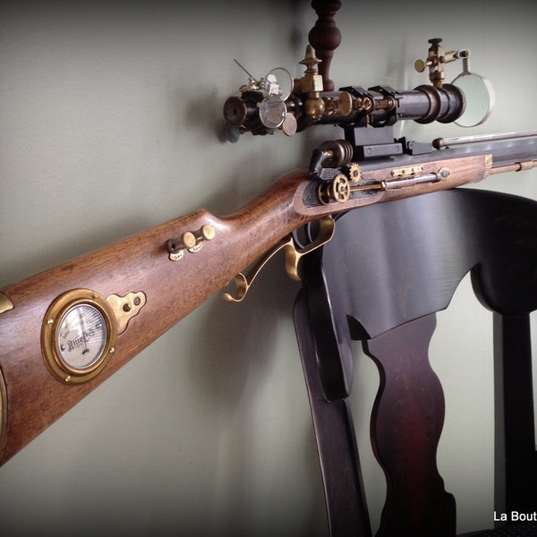 Handmade steampunk rifle made from vintage and antique recycled 1800s surveyor scope brass parts with victorian charm