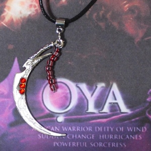 Oya Necklace, with sickle blade pendant and a black wax cord necklace with extender