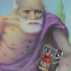 San Lazaro Stainless steel adjustable ring, Babalu aye image under glass on an a unisex ring