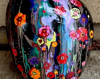 Flowers beautiful and vibrant hand painted on a large rock approximately 7“ x 6“ x 3“