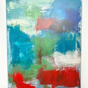May include: An abstract painting on canvas featuring layered brushstrokes of vibrant red, deep blue, bright turquoise, and forest green. The composition includes patches of white and light blue, with the artist's signature visible in the bottom right corner.