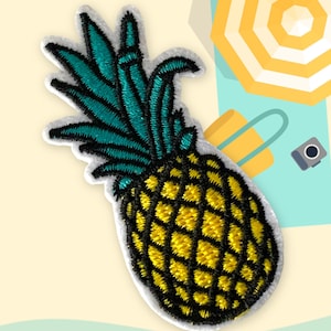 May include: A yellow and green embroidered pineapple patch. The pineapple is on a white background.