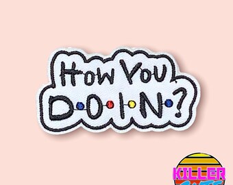 May include: White iron-on patch with black embroidered text that reads "How You Doin?" with colorful dots in the word "Doin".