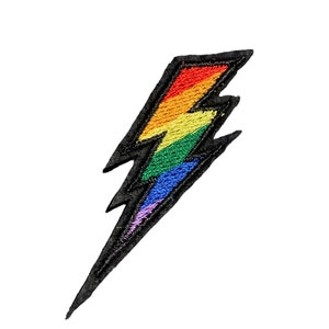May include: Rainbow coloured lightning bolt embroidered patch with black outline.