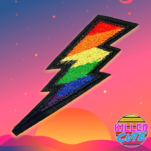 May include: Rainbow coloured lightning bolt embroidered patch with black outline. The patch is on a pink and purple background with a sunset in the background.