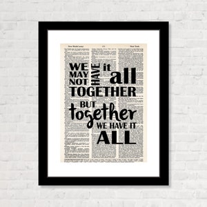 May include: Black and white typography on a vintage book page. The text reads "We may not have it all together but together we have it all."