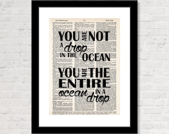 May include: A black and white image of a quote printed on a vintage book page. The quote reads "You are not a drop in the ocean. You are the entire ocean in a drop."