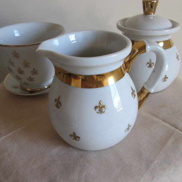 Vintage White and 22-Karat Gold Hand Painted Porcelain "Fleur De Lis" Cream Sugar Set Tea Cup Tiny Saucer Plate