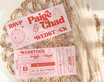 May include: Two pink WEDSTOCK wedding invitations with red text, featuring the names Paige & Chad, a disco ball graphic, and the date June 13, 2026. The invitations are on a woven placemat with dried ornamental grass.