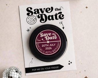 May include: A 'Save the Date' magnet shaped like a vinyl record, with the text 'Save the Date' and event details. The magnet is on a white card with additional text and decorative elements. The text reads: '20th July 2026, Rachel's 40th Birthday!'