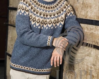 May include: A blue, brown, and white patterned sweater with a crew neck. The sweater is made of wool and has a traditional Scandinavian design.