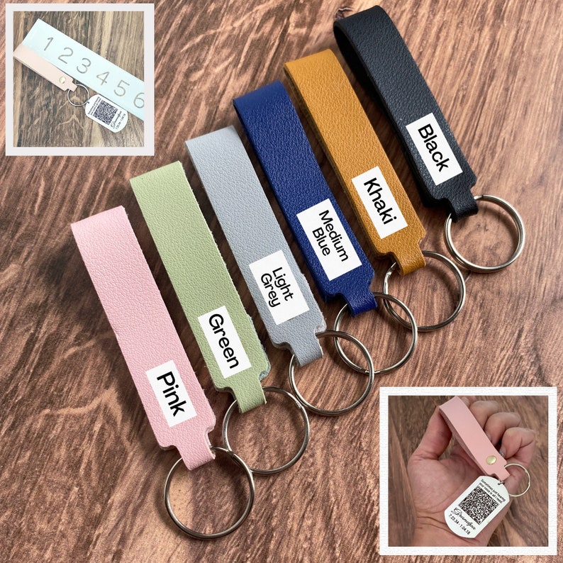 K&ouml;nnte beinhalten: Sieben Leder-Schl&uuml;sselanh&auml;nger in verschiedenen Farben, darunter rosa, gr&uuml;n, hellgrau, mittelblau, khaki und schwarz. Jeder Schl&uuml;sselanh&auml;nger hat einen Metallring und ein Etikett mit dem Farbnamen.