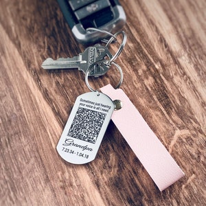 Pink leather strap keychain with a 1 in X 2 in dog tag attached. Permanently engraved with the saying, Sometimes just hearing your voice is all I need, unique QR Code of his voice, the name Grandpa, and the dates 7.23.34 - 1.4.18