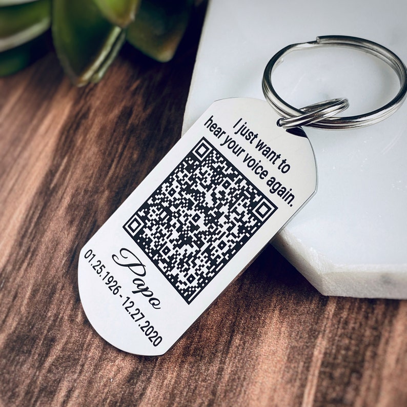 Engraved memorial dog tag keychain made with Silver stainless steel measuring 1 in x 2 in and attached to a 1 in keyring. Engraved with the saying I just want to hear your voice again. An Audio QR Code and Papo, 1.25.26 - 12.27.20