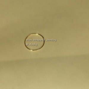 May include: A simple gold wire ring, perfect for jewelry making or crafting.
