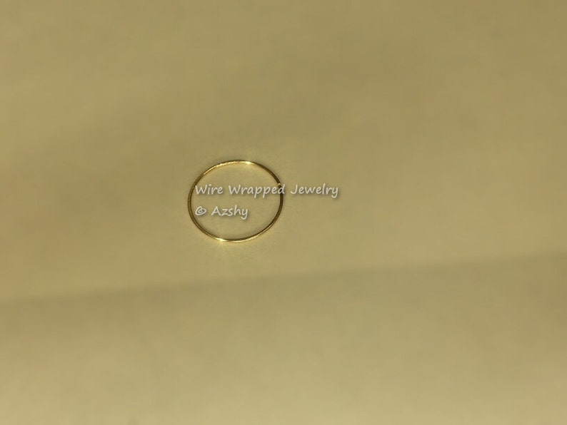 May include: A simple gold wire ring, perfect for jewelry making or crafting.