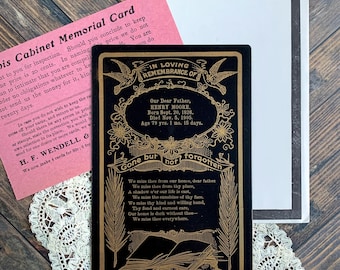 May include: A black memorial card with gold text and illustrations featuring the words In Loving Remembrance Of, Henry Moore, Born Sept 20, 1826, Died Nov 5, 1905, Age 79 yrs 1 mo 15 days, Gone but not forgotten, and a poem above an open book.