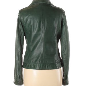 May include: A dark green leather jacket with a zipper closure and long sleeves.