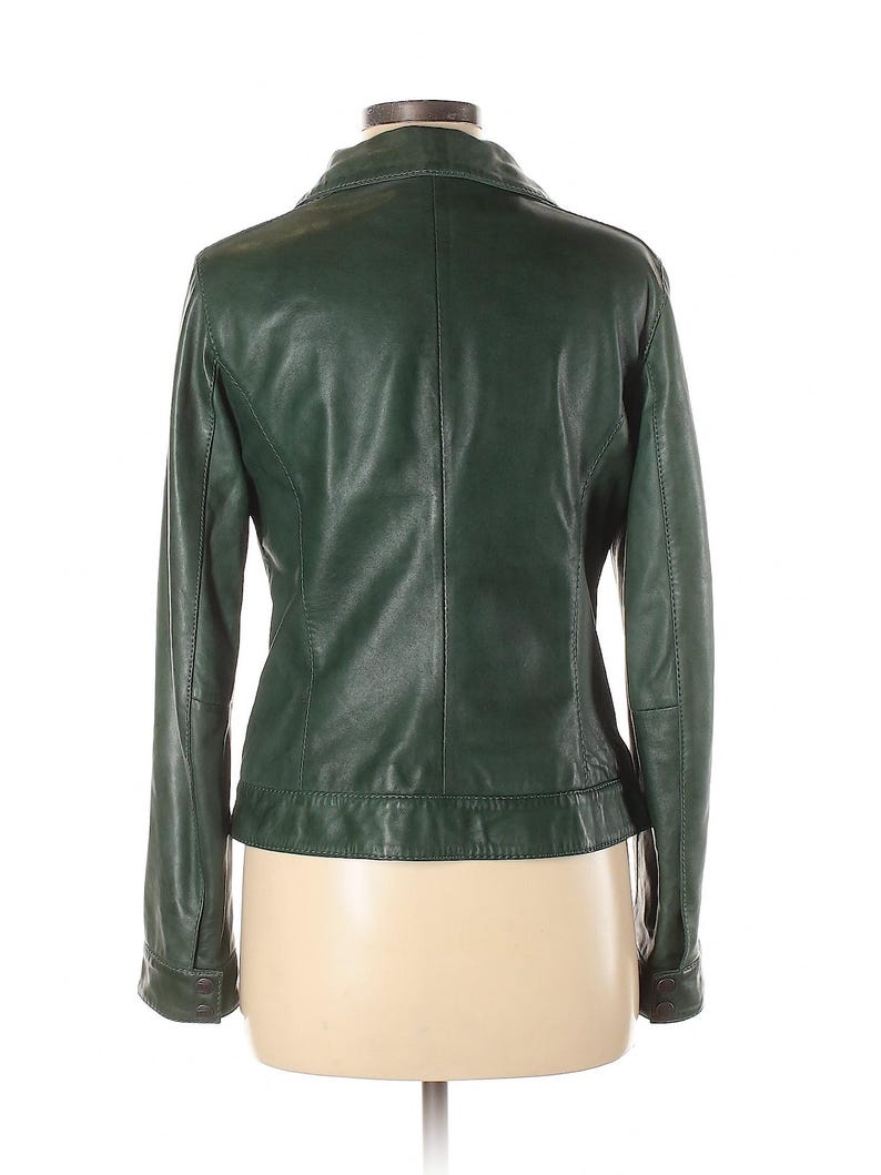 May include: A dark green leather jacket with a zipper closure and long sleeves.