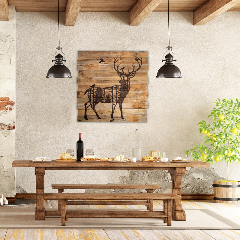 Extra large rustic deer wall  hanging for dinning room.  It has a dark brown silhouette of a deer with forest scenery inside the body. Birds sit on their antlers. Artwork in wood-burning entirely by hand. The wood is naturally weathered brown.