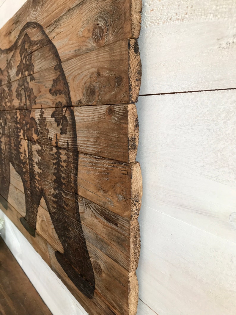 This shows the rustic rough wood edge or the bear wall art.