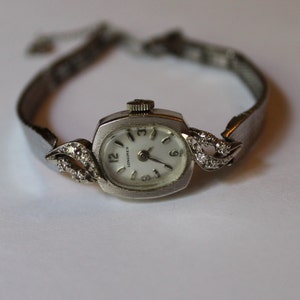 Reserved for eugenie Longines white gold and diamond watch, 14 kt gold with eight diamonds