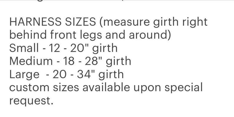 May include: Text on a white background details harness sizes. Small fits 12-20 inch girth, medium fits 18-28 inch girth, and large fits 20-34 inch girth. Custom sizes are available upon request.